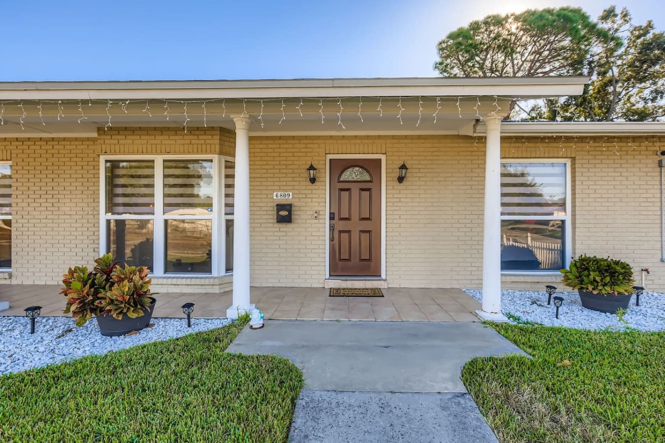 A warm welcome awaits behind this door, complete with cozy touches and curb appeal.