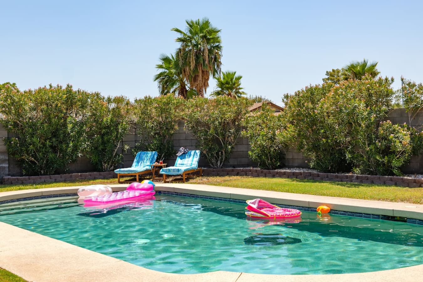 The backyard provides a private sun soaked oasis featuring a private pool and gas propane BBQ.