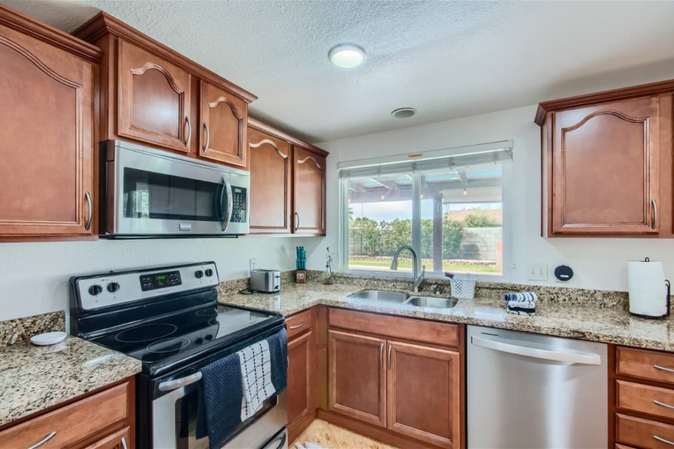 The fully equipped kitchen boasts updated appliances and plenty of counter space for all your cooking needs.
