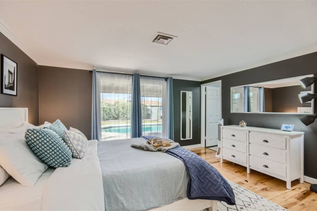 Master Bedroom features large walk in closet and separate exit onto patio and pool area.
