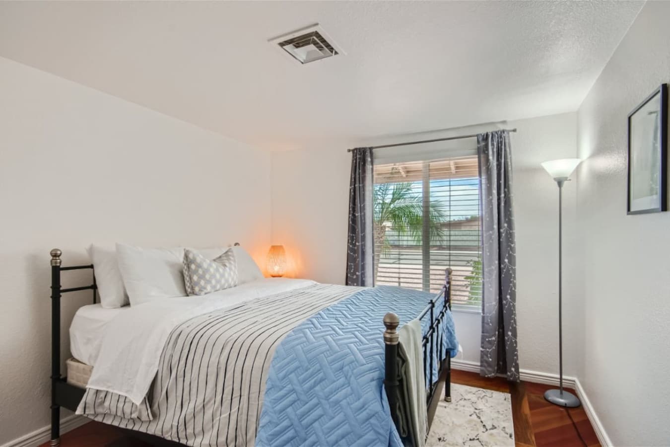 Bedroom two featuring a queen size bed.