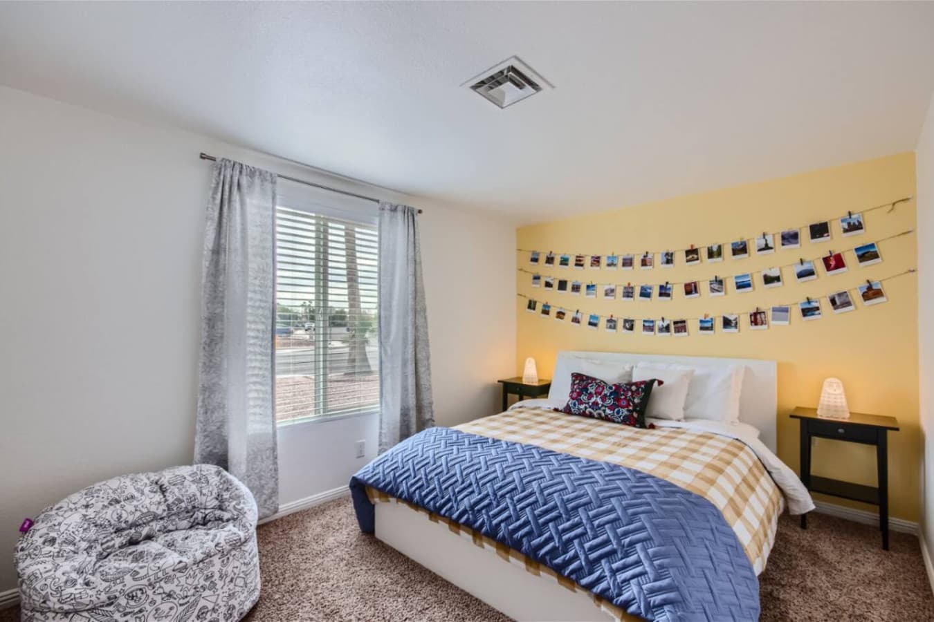 Bedroom three featuring a queen size bed.