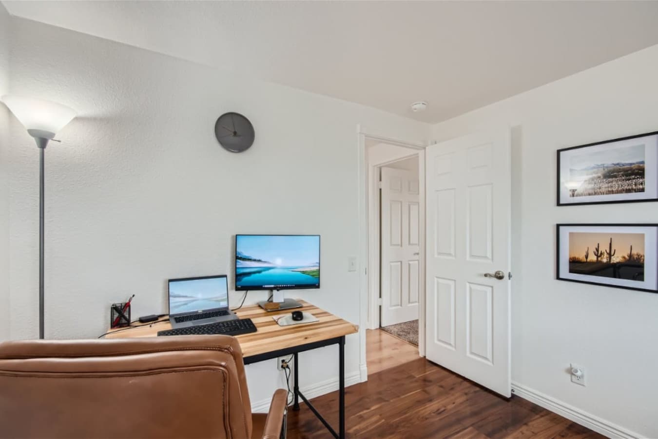 Enjoy a dedicated workspace featuring a monitor, desk and chair.