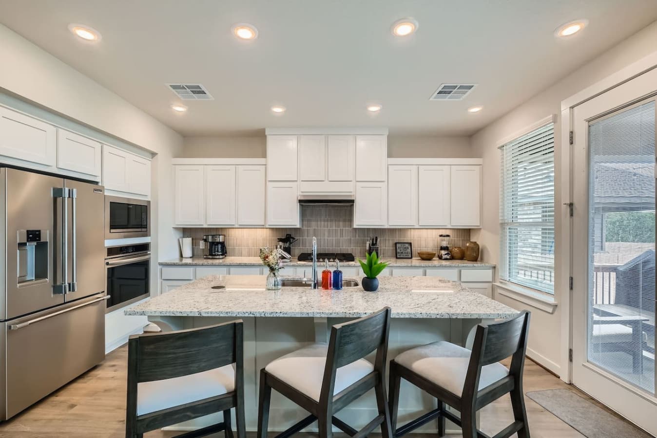 Modern appliances meet minimalist charm in the kitchen.