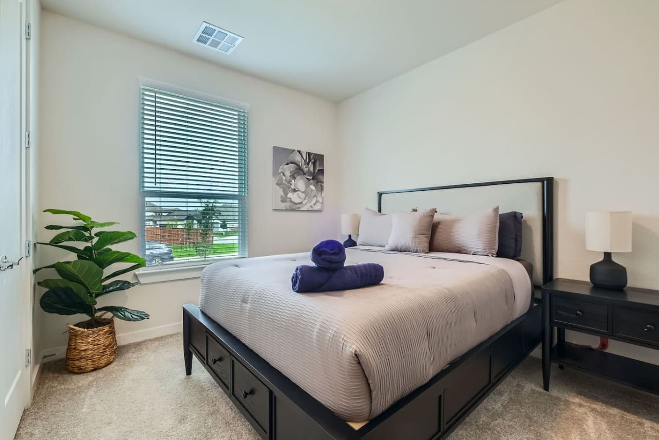 The third bedroom featuring a queen size bed.