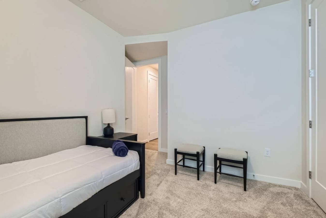 The fourth bedroom offers a snug double bed in a calm, inviting space.