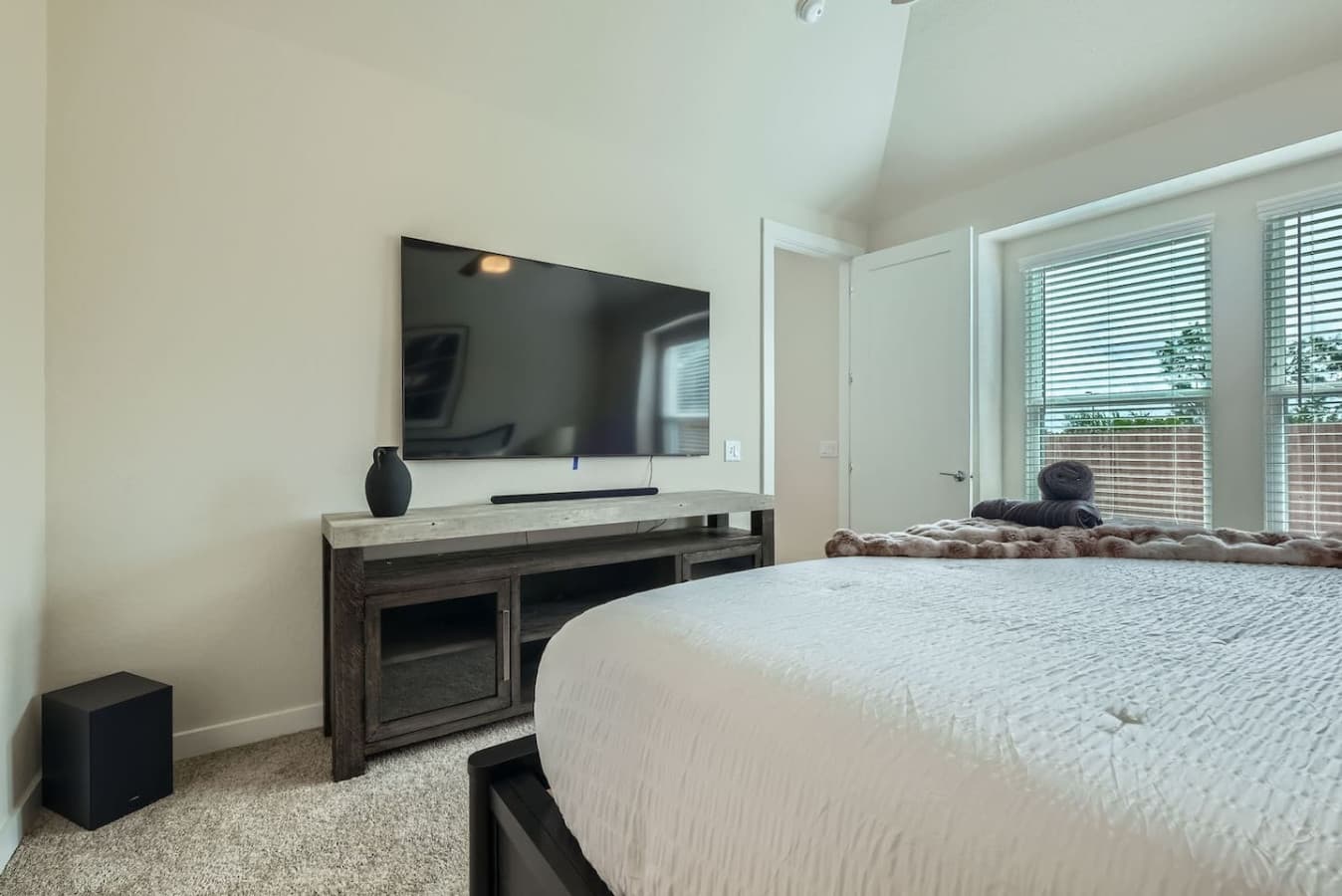 Enjoy your favorite tv show or movie in the master bedroom.
