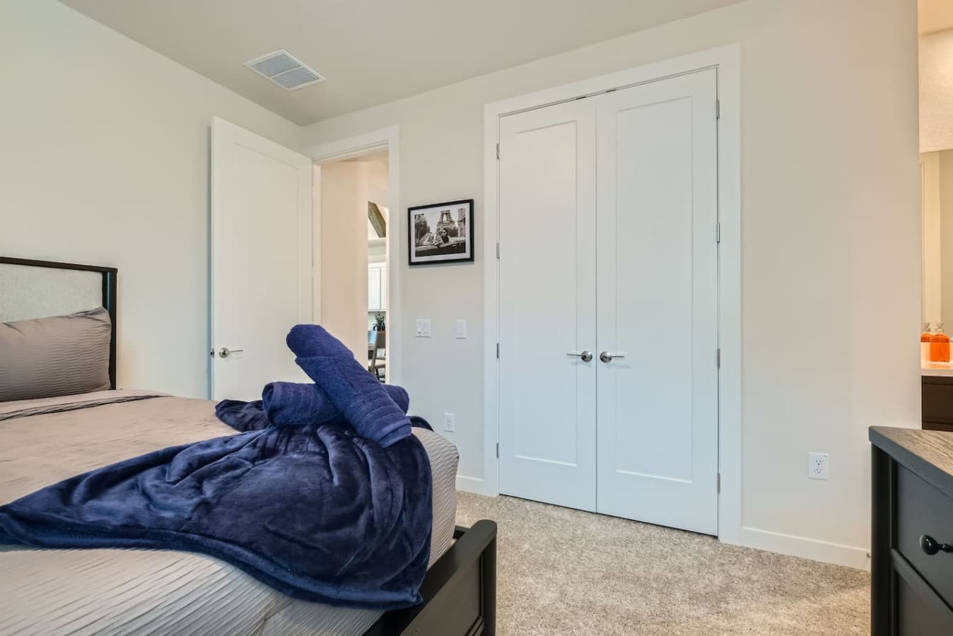 Clothing storage and a shared bathroom in the second bedroom.