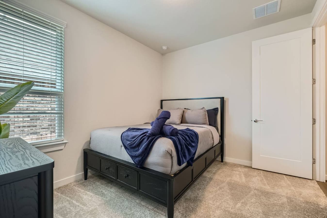 Comfortable queen bed and plenty of clothing storage in the second bedroom.