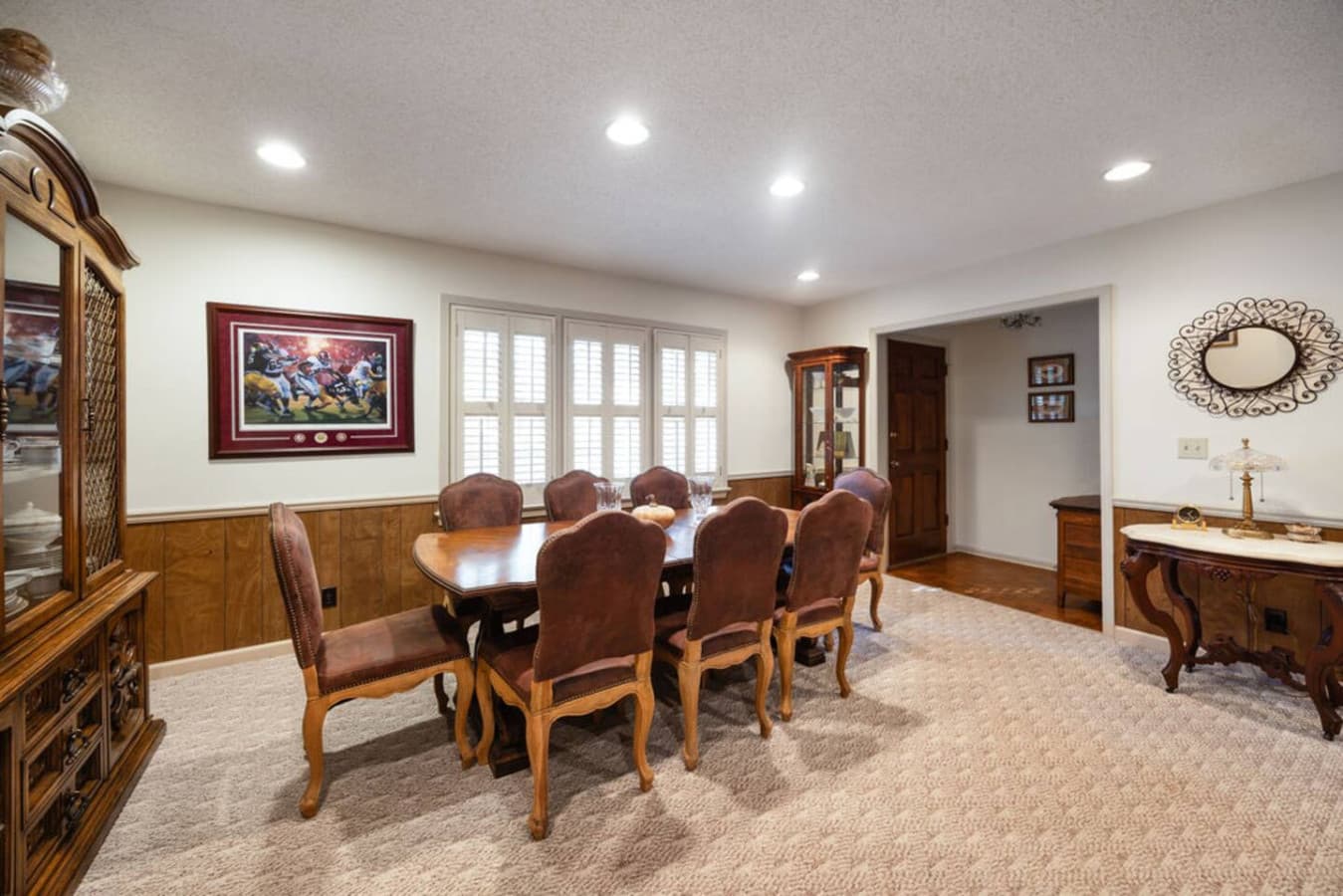A spacious dining area with seating for large groups and plenty of natural light.