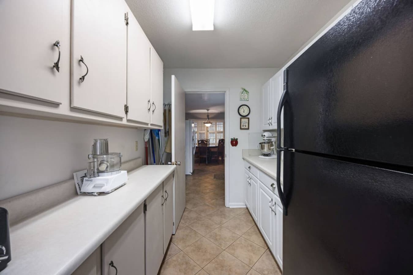 A long galley kitchen offering plenty of room for meal prep.