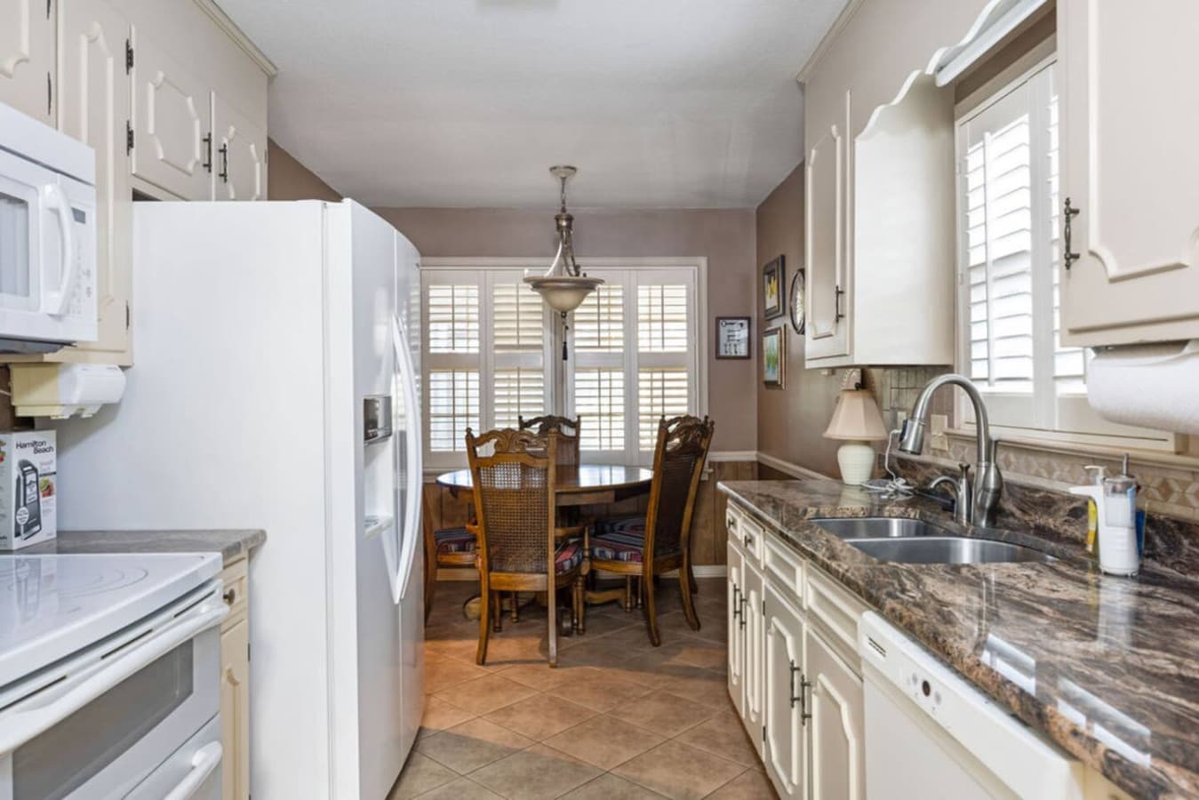 A cozy dining nook right off the kitchen perfect for shared meals.