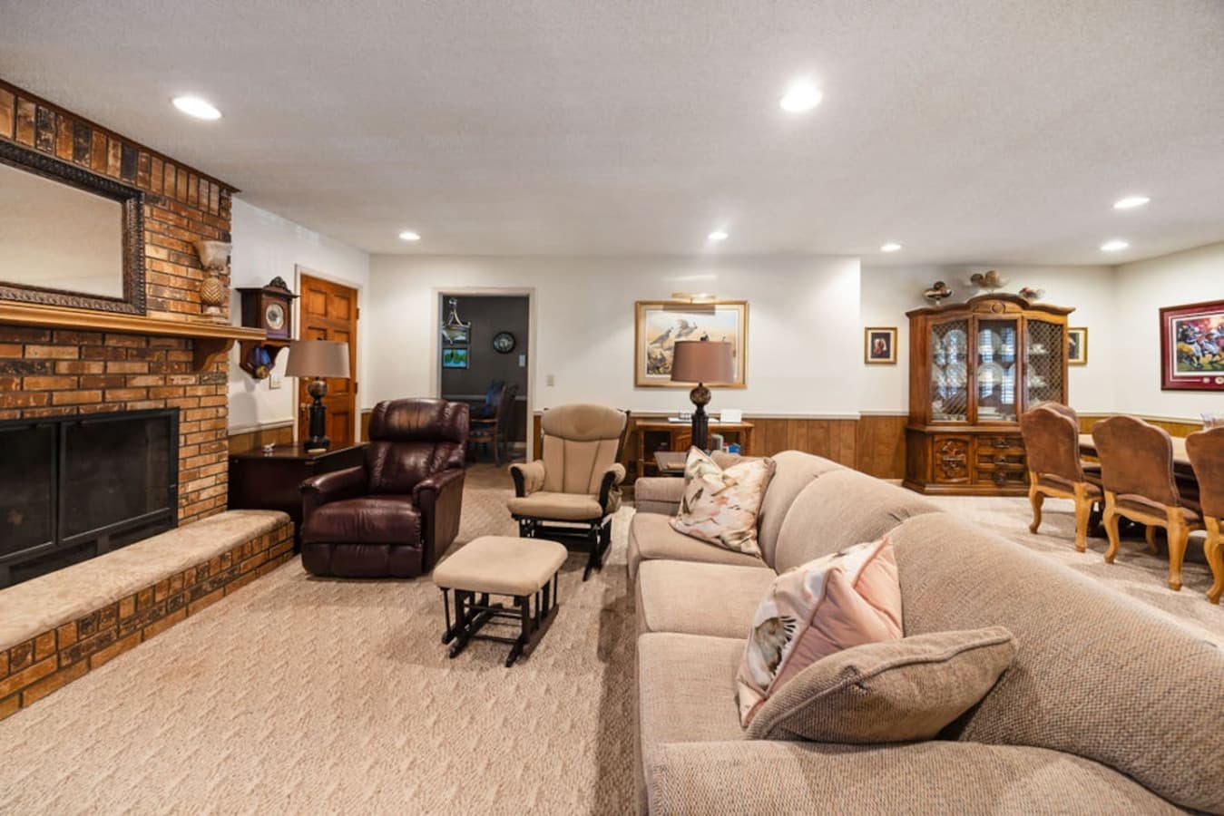 A spacious living room with cozy seating arranged for comfortable gatherings.