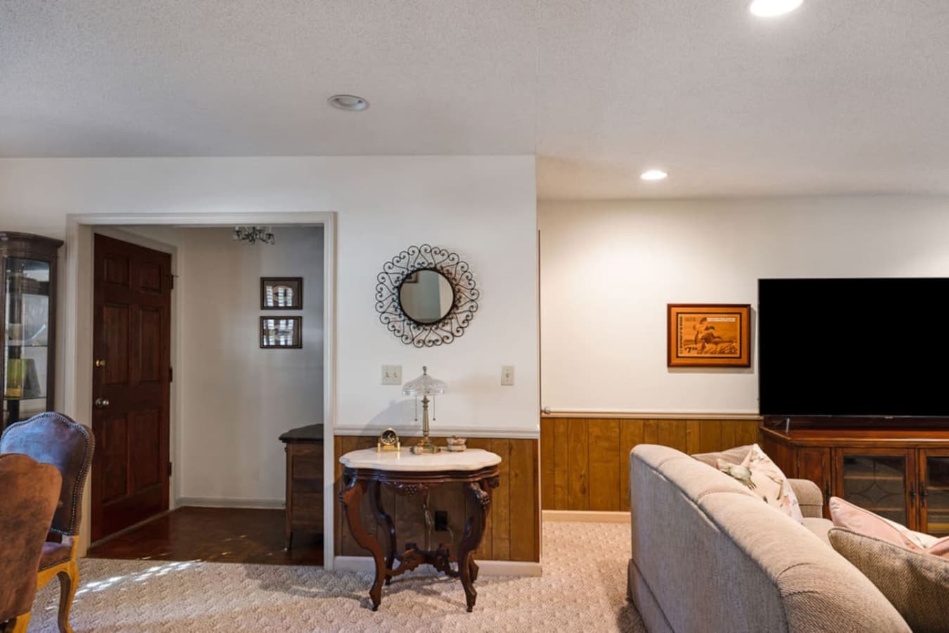 A bright entryway with a decorative mirror and a welcoming console table.