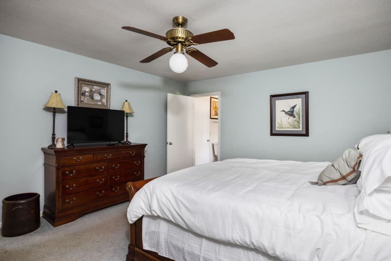 A spacious bedroom with classic furnishings and plenty of room to relax.