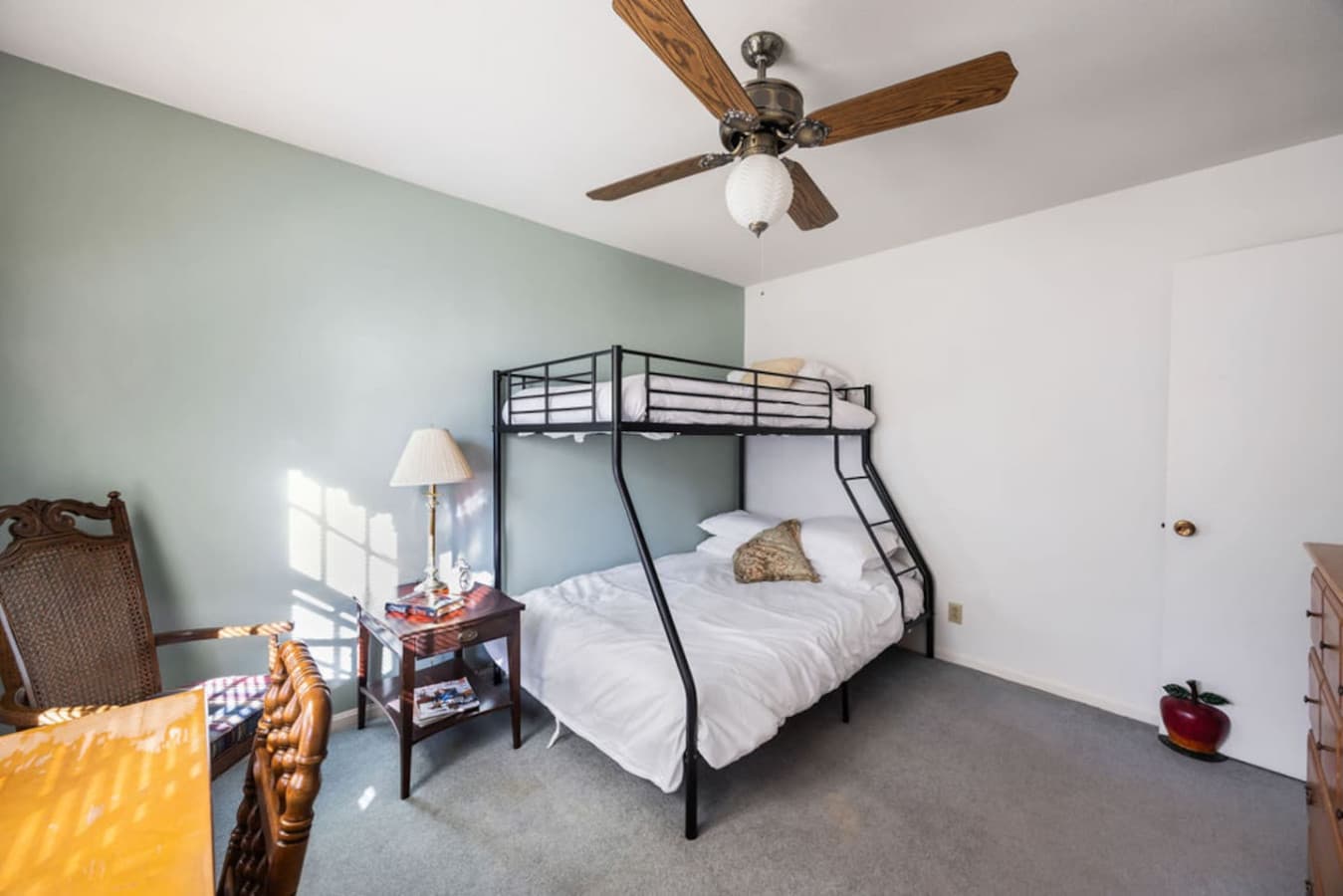 A bright bunk room with plenty of natural light and comfortable sleeping space.