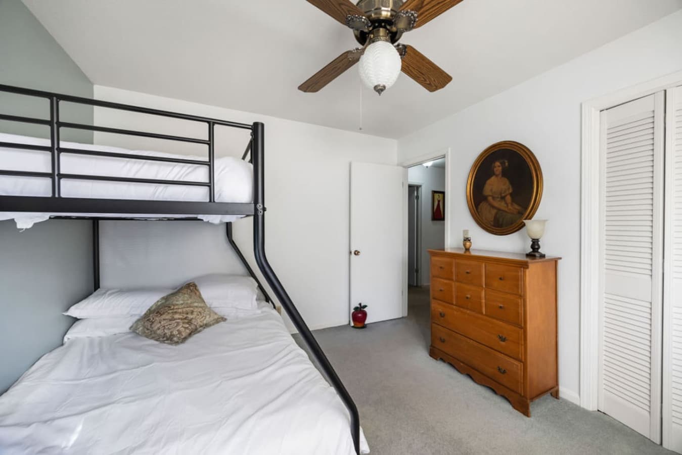 A clean and simple bedroom setup designed for an easy and relaxing stay.