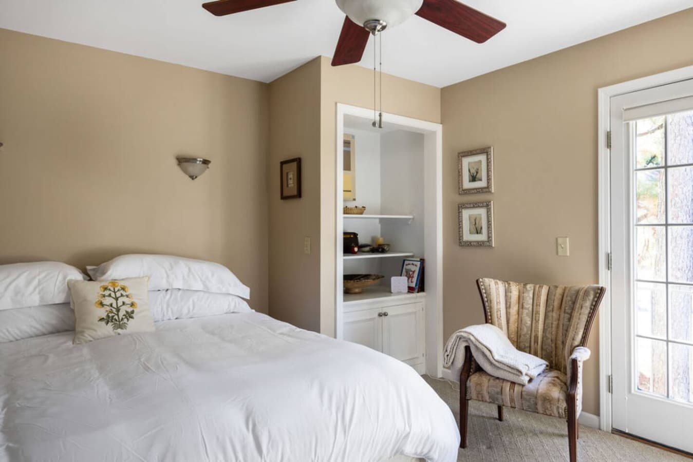 A warm bedroom with soft lighting and a comfortable bed for restful nights.
