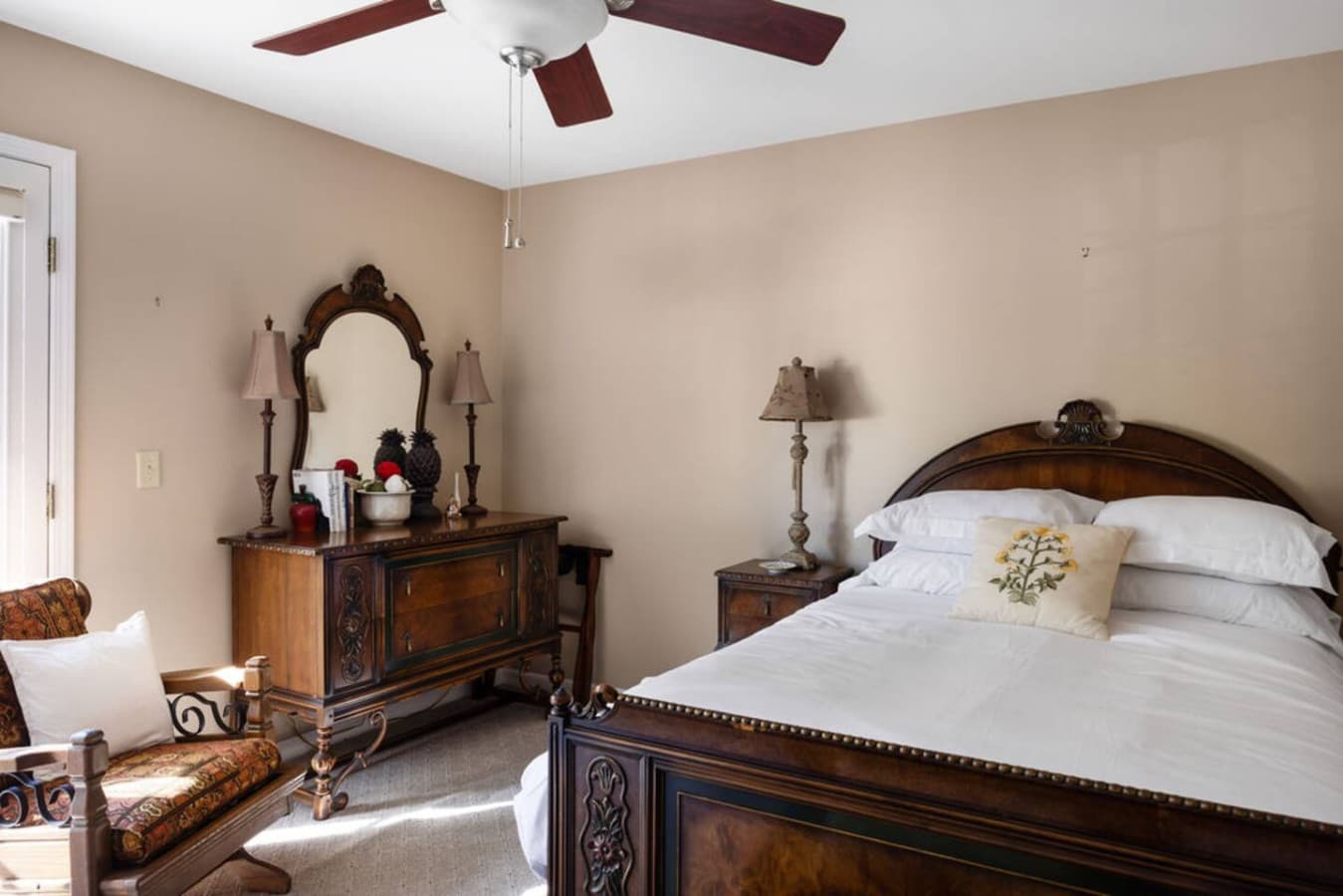 A beautifully styled room featuring timeless furniture and a cozy atmosphere.
