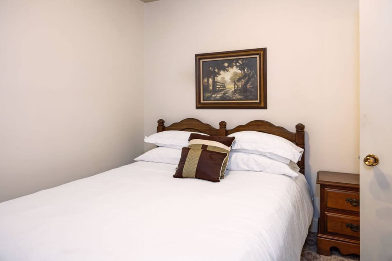 A cozy bedroom with a comfortable bed and warm accents.