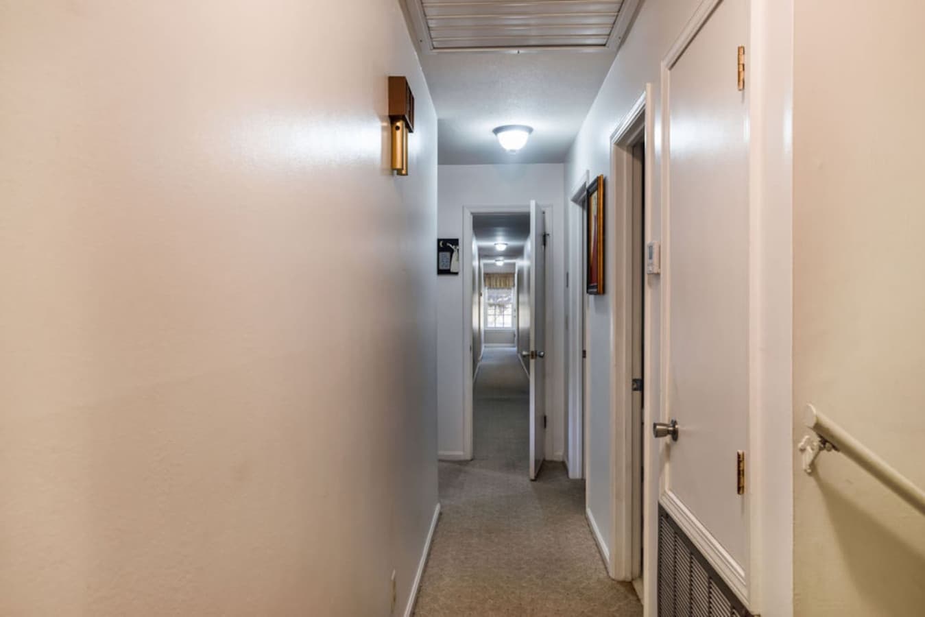 A clean hallway that connects the bedrooms and living spaces.