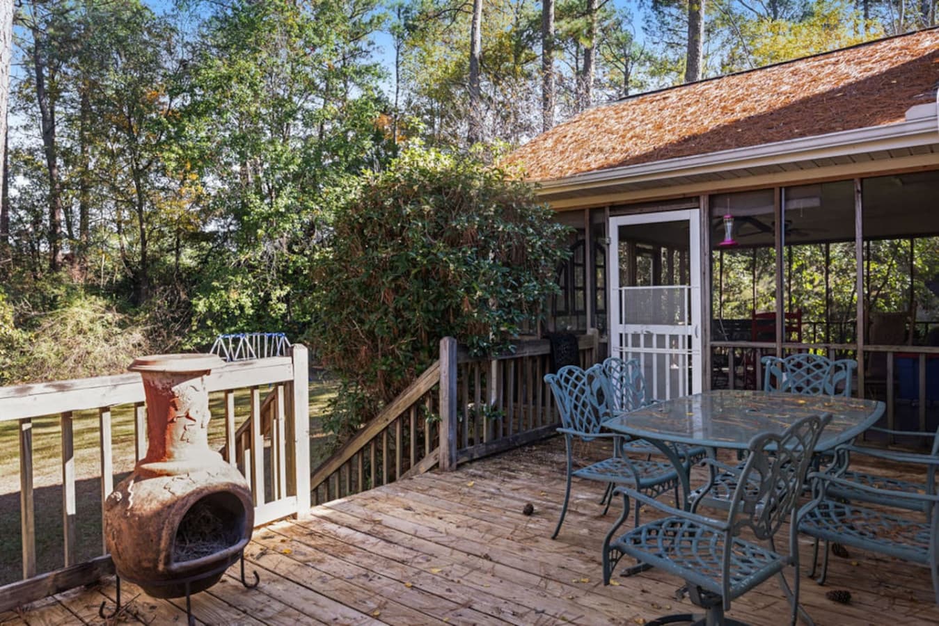 A quiet deck surrounded by greenery for peaceful outdoor moments.