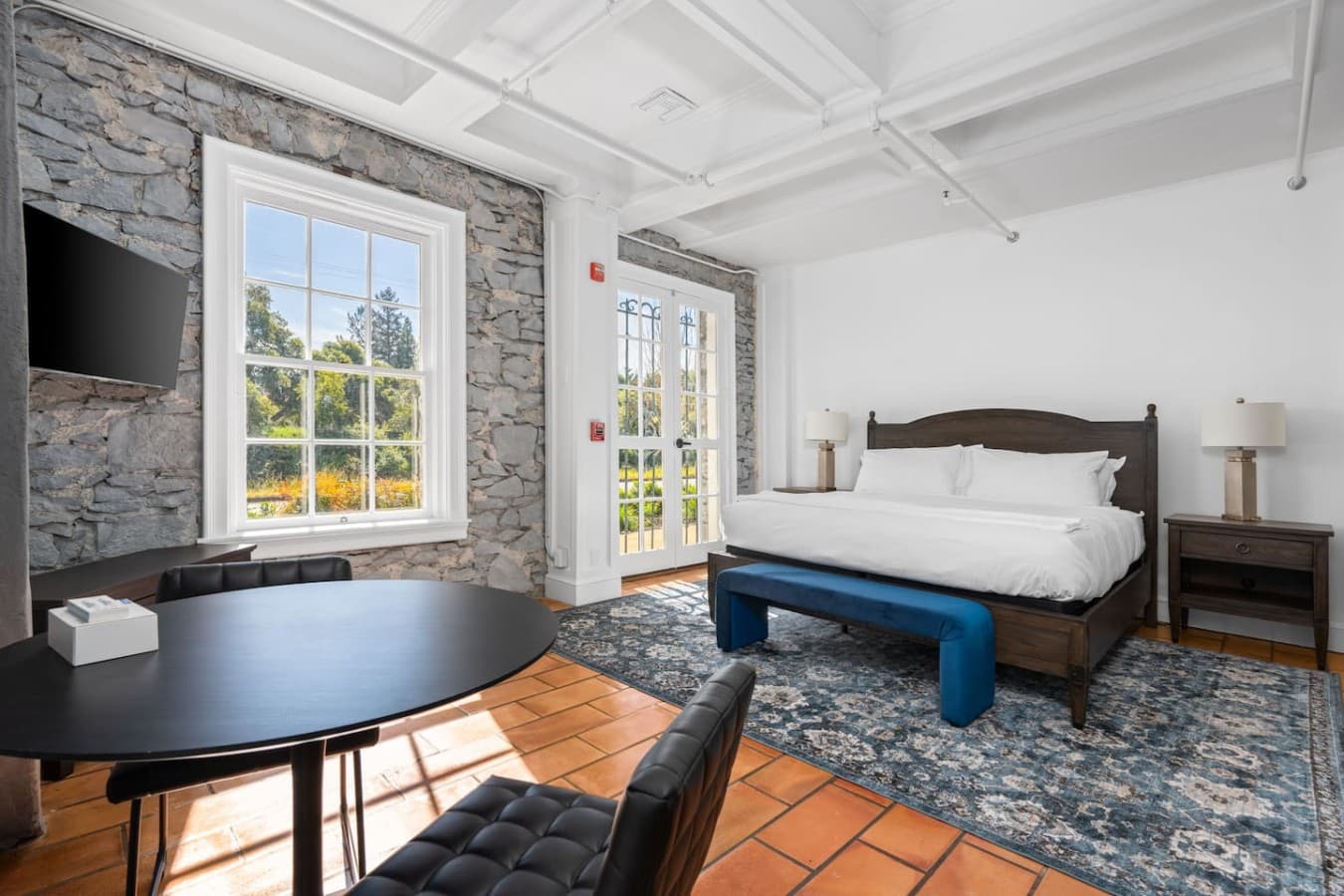 This is the private room you will be renting with large windows, natural light, and a relaxing king bed setup.