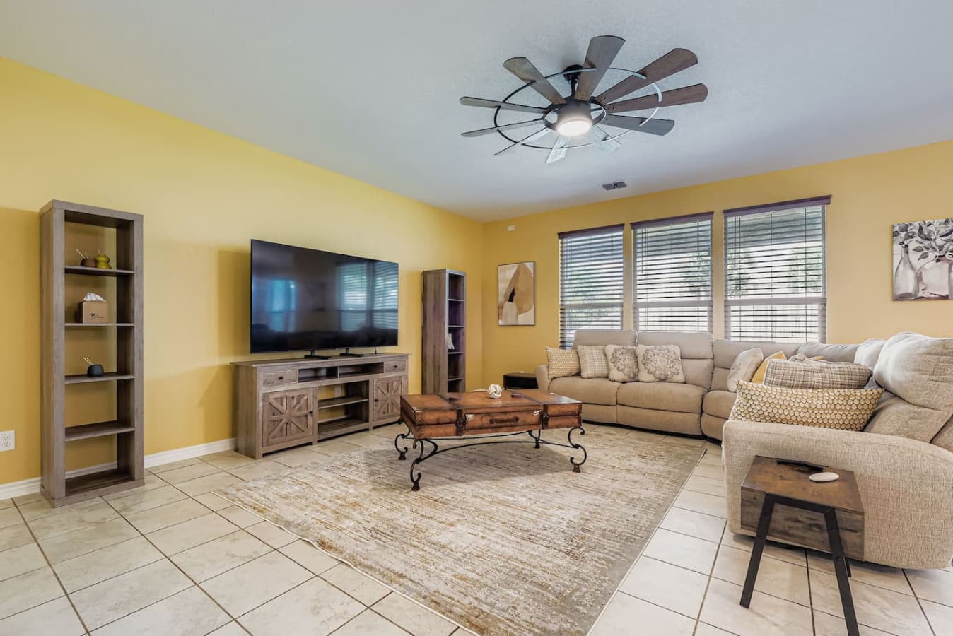 Spacious living room with reclining seats at the end of each couch.