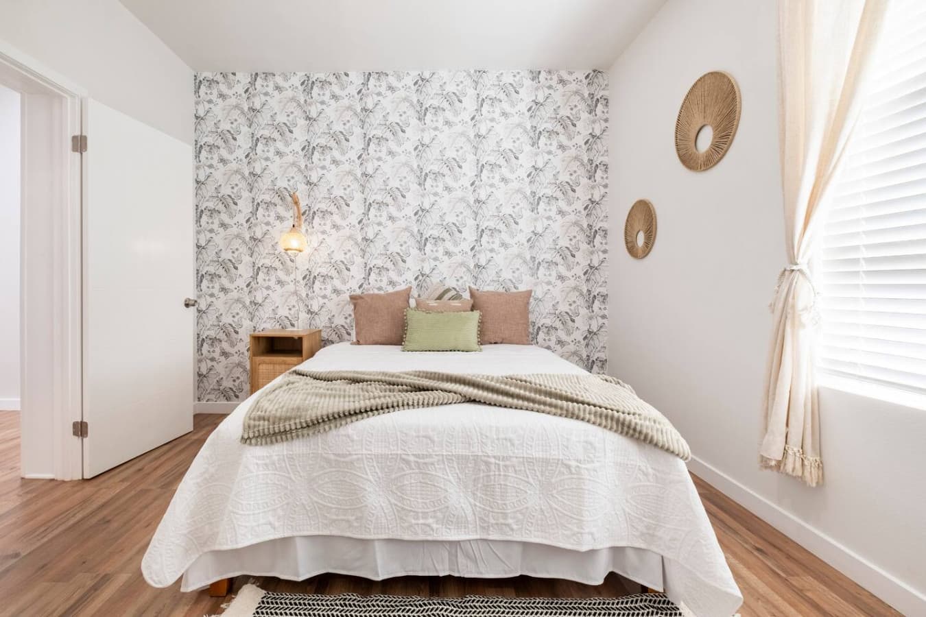 The master bedroom features a queen size bed.