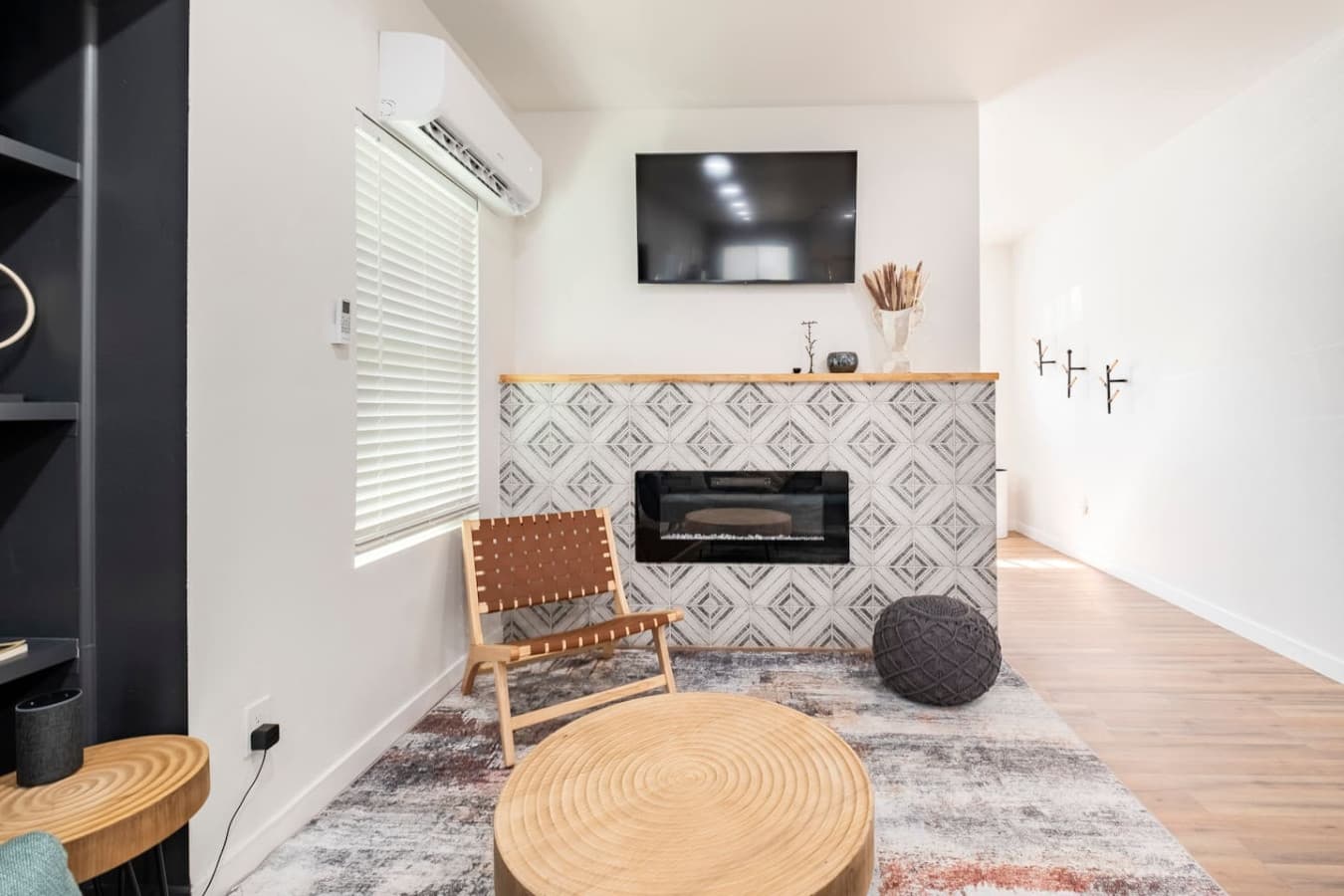 The living room features a smart TV.
