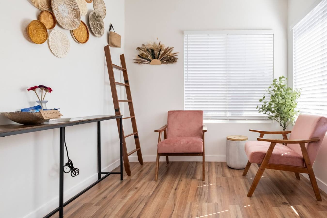 Snug corner in the home with seating and a desk.