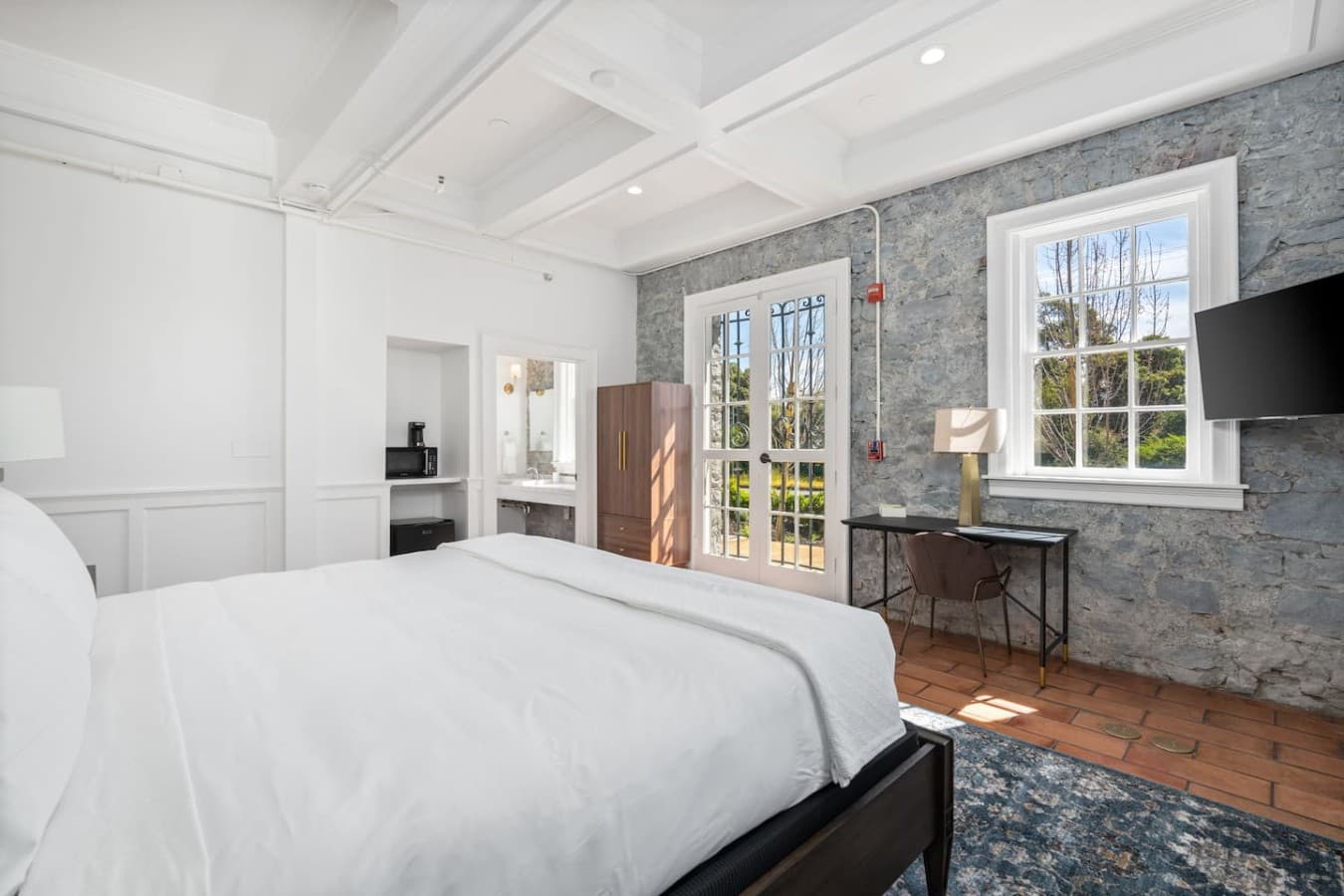 This is the private room you will be renting offering a bright open space with large windows and comfortable furnishings.