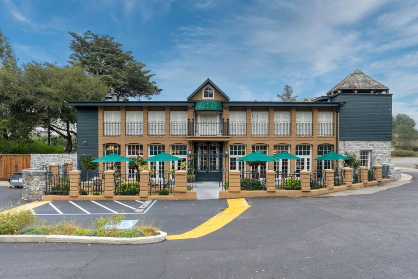 A beautifully landscaped walkway leading to the hotel’s charming exterior and guest access points.