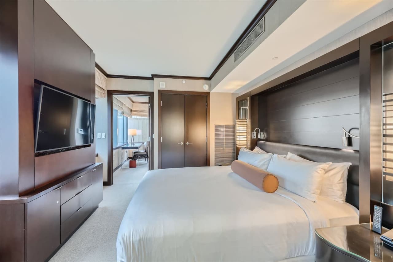 One bedroom with king-size bed and plush pillow-top mattress, environmental controls, drawers, and 42" digital LCD flat-screen TV.