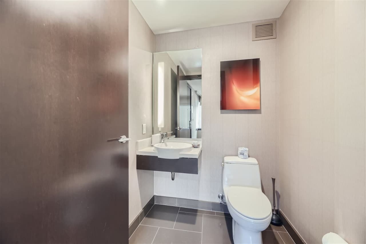 A private half-bathroom off the living room/kitchen.