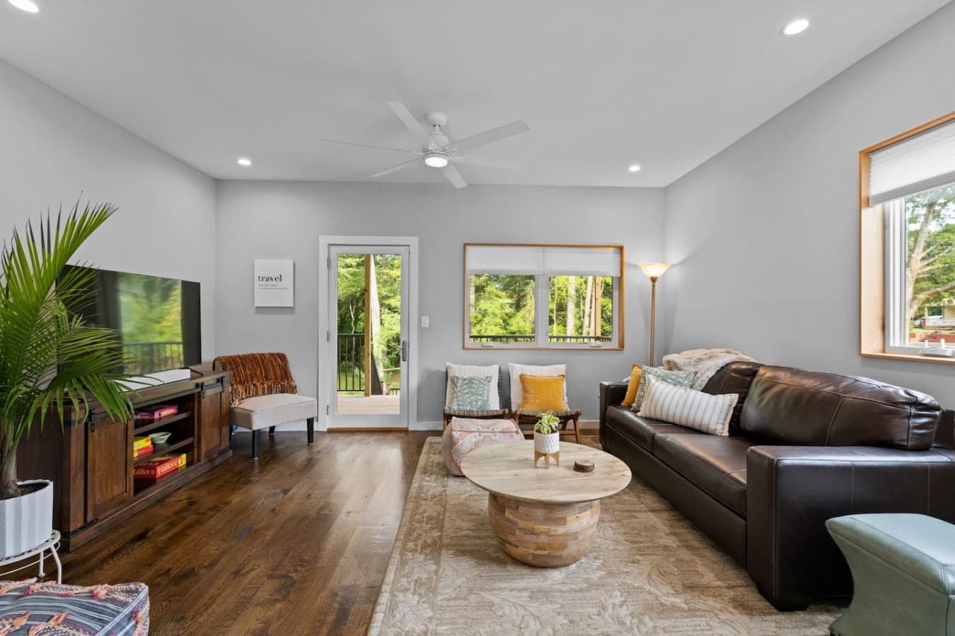 Living room space with queen size sofa bed and smart tv.