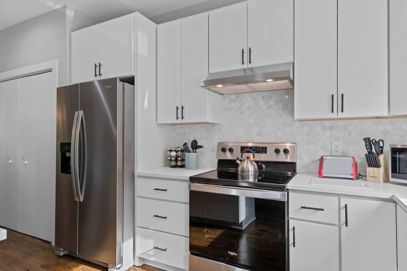 Stainless steel appliances in the kitchen.