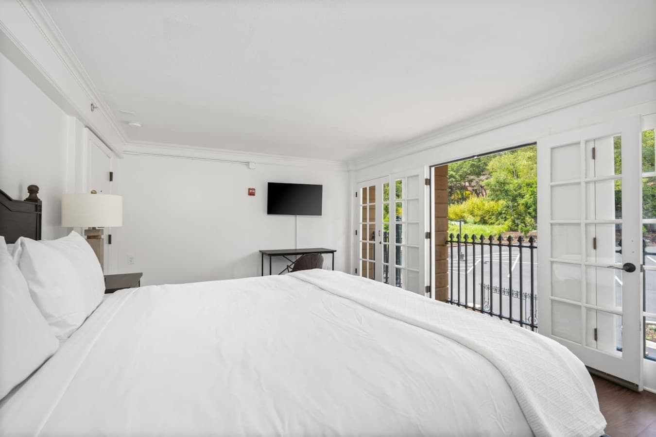 This is the private room you will be renting offering a comfortable king bed, natural light, and a mounted TV for convenience.