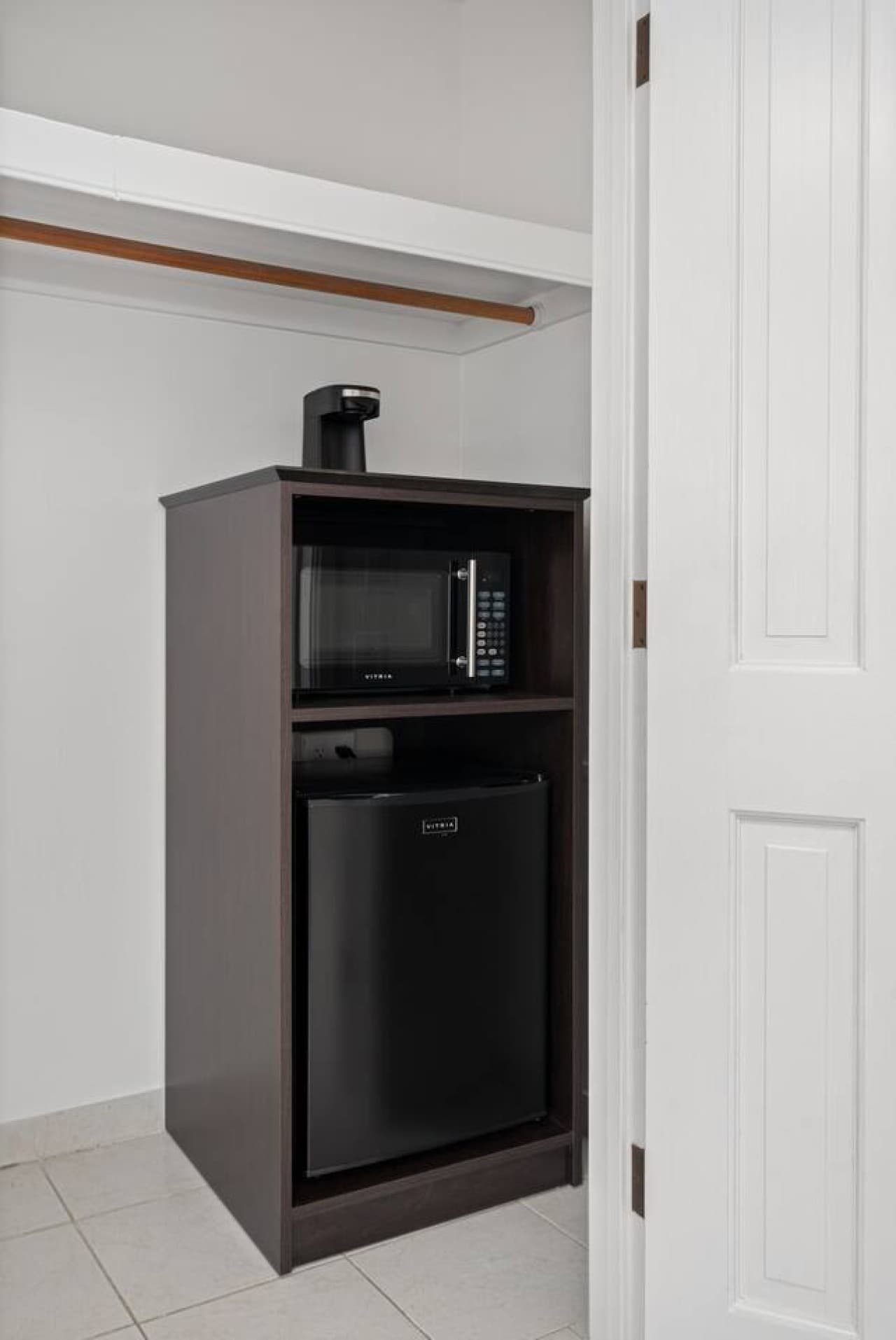 This is the private room you will be renting featuring an in-room microwave and mini fridge for added comfort during your stay.