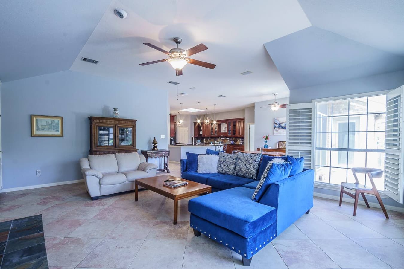 Unwind in this airy living space featuring plush seating perfect for relaxing or entertaining.