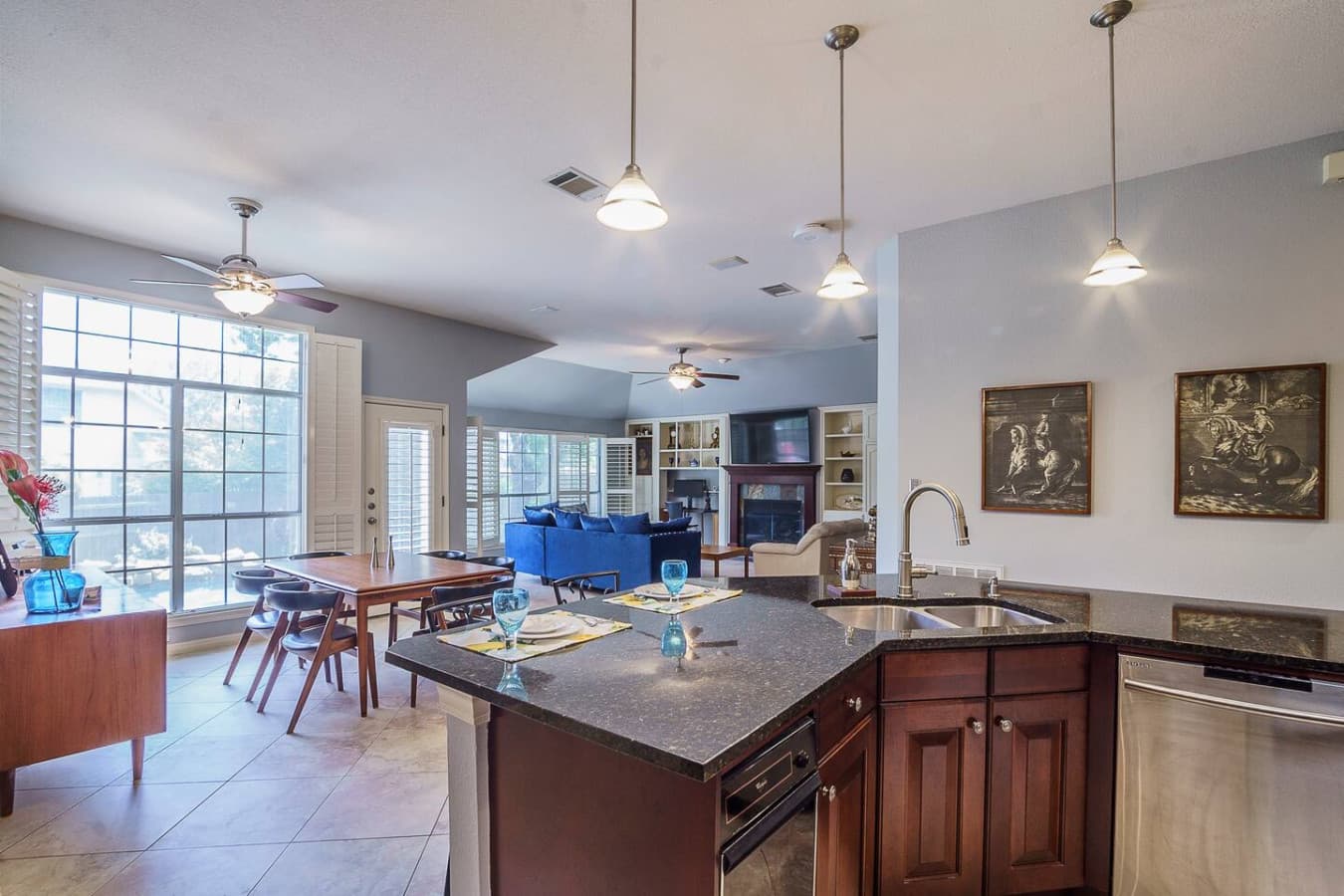 Stylish kitchen with island seating and easy flow to the dining area.