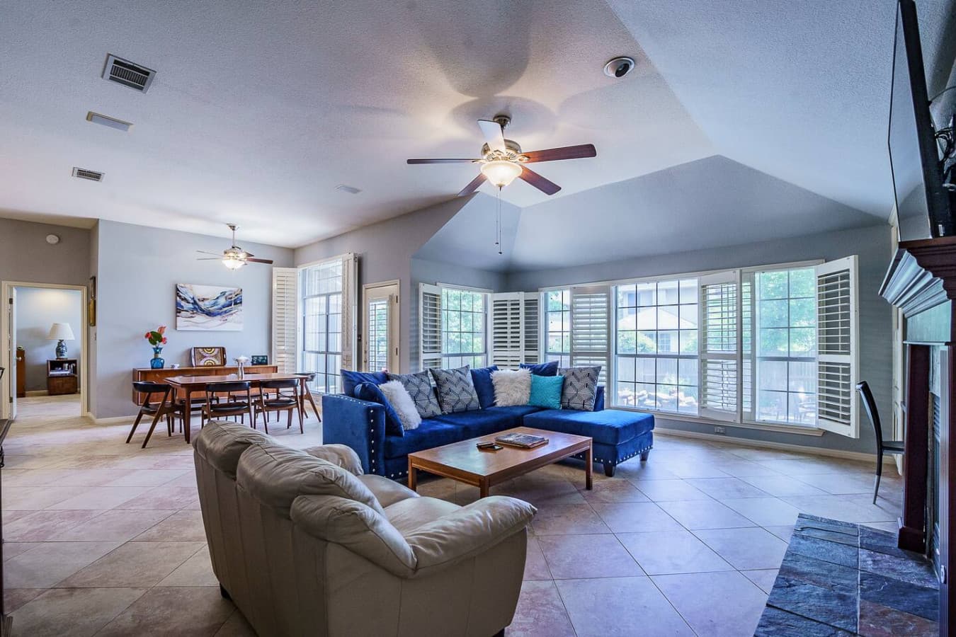 Gather with friends or family in this spacious and sunlit living room.