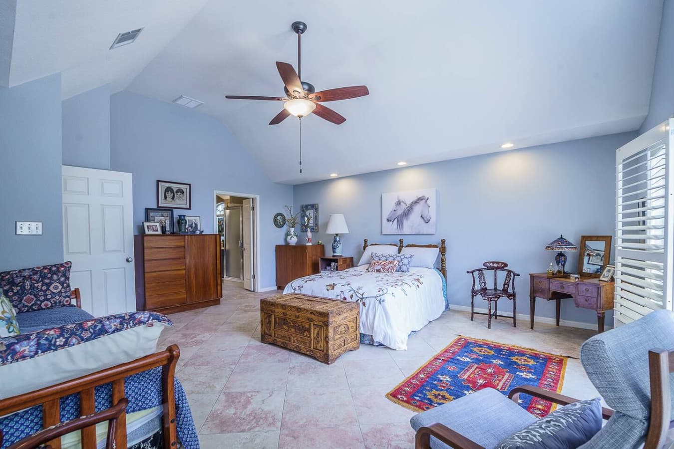Spacious master suite with queen bed and additional twin sleigh bed.