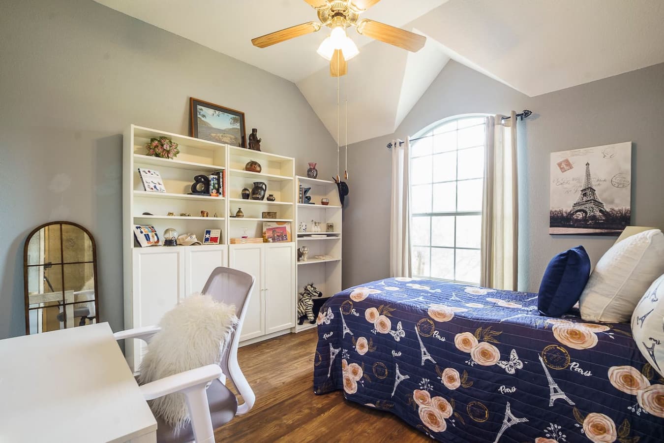 Third bedroom with full sized bed and dedicated workspace.