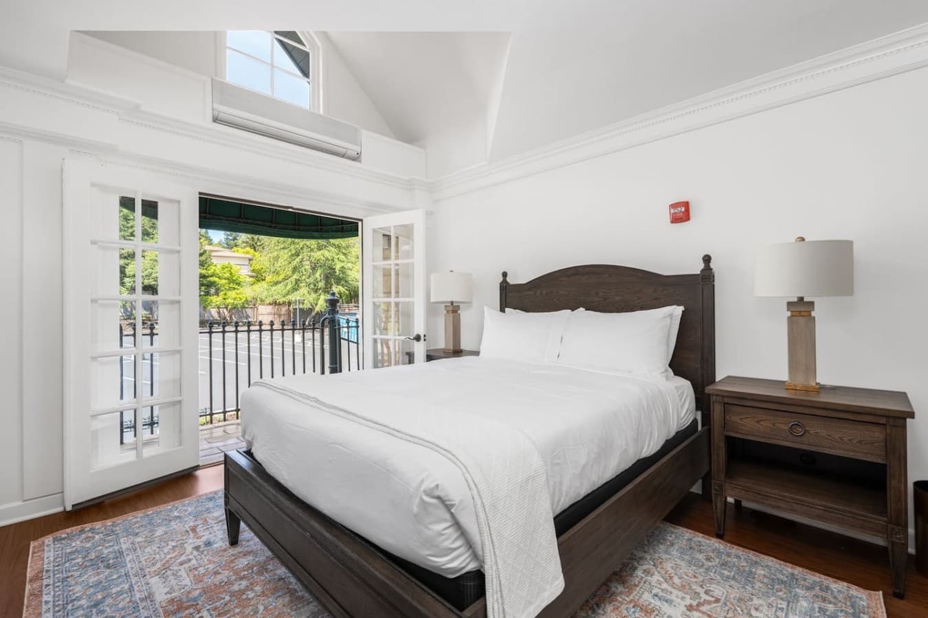 This is the private room you will be renting with a cozy king bed, balcony access, and serene outdoor views.