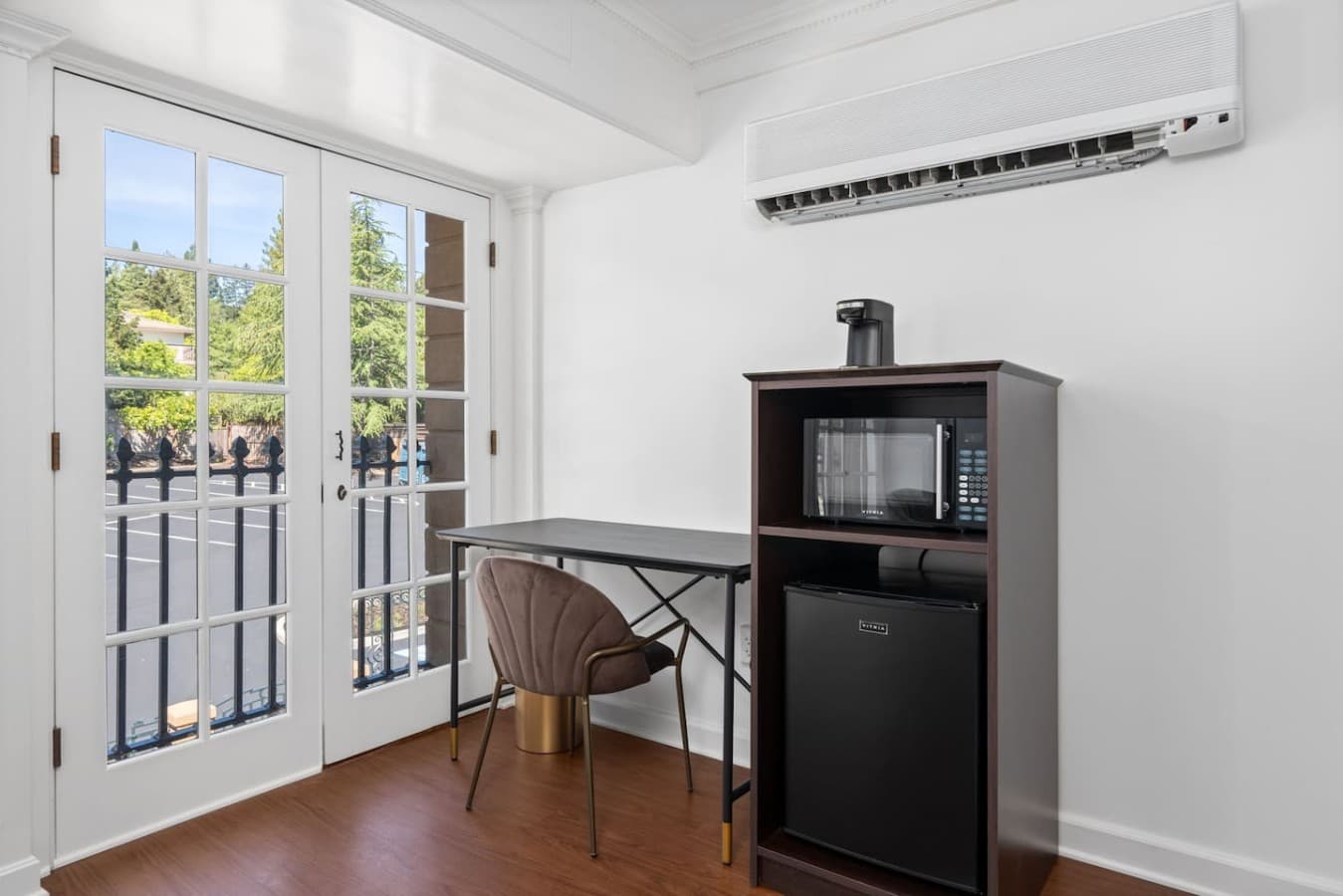 This is the private room you will be renting featuring an in-room workspace, mini fridge, and microwave for added convenience.