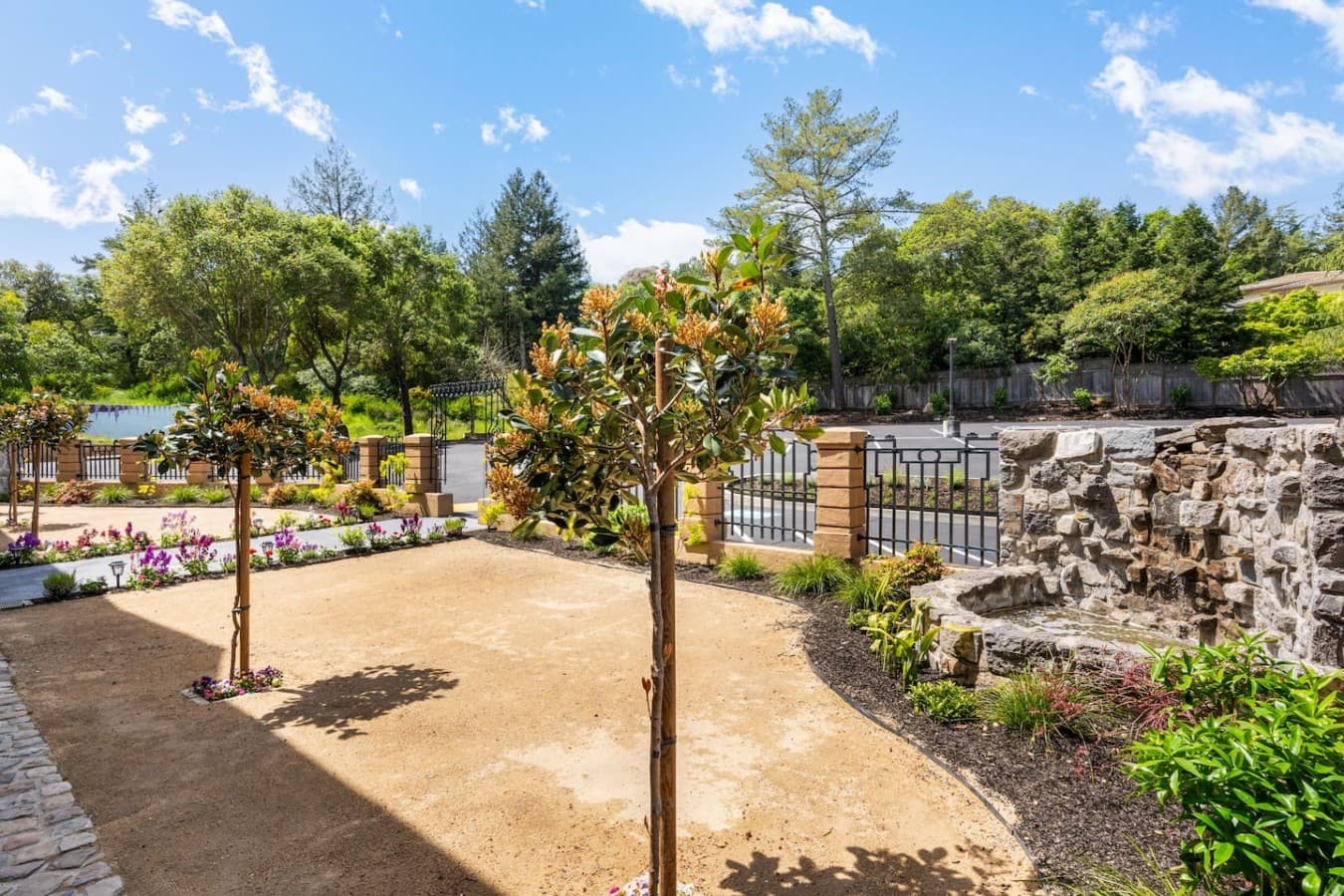 A landscaped outdoor walkway featuring garden details and serene natural surroundings.
