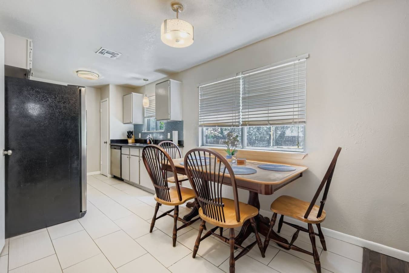 Dining table right next to the kitchen.