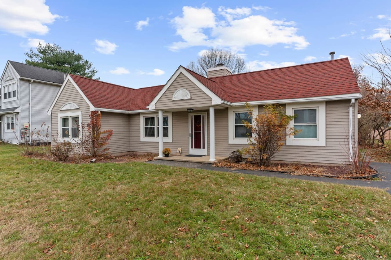 Exterior view of the home with classic siding and warm tones.