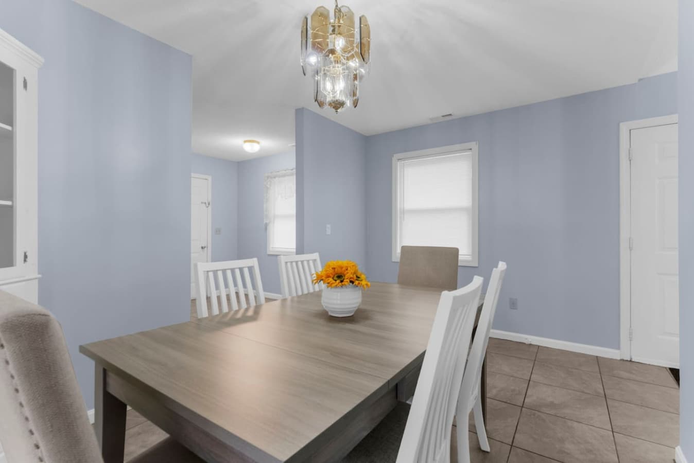 Bright dining area with a spacious table for shared meals.